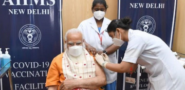 Indian PM rejects calls to widen vaccine access as infections hit record