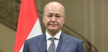 Iraqi president signs decree for early polls in October
