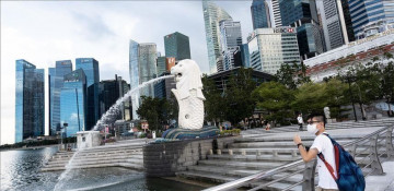 Singapore tightens virus curbs after infections spike