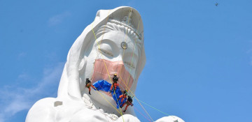 Giant Buddhist goddess in Japan gets face mask to pray for end of COVID-19