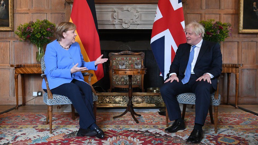 UK PM Johnson meets Germany's Merkel with COVID travel rules in focus