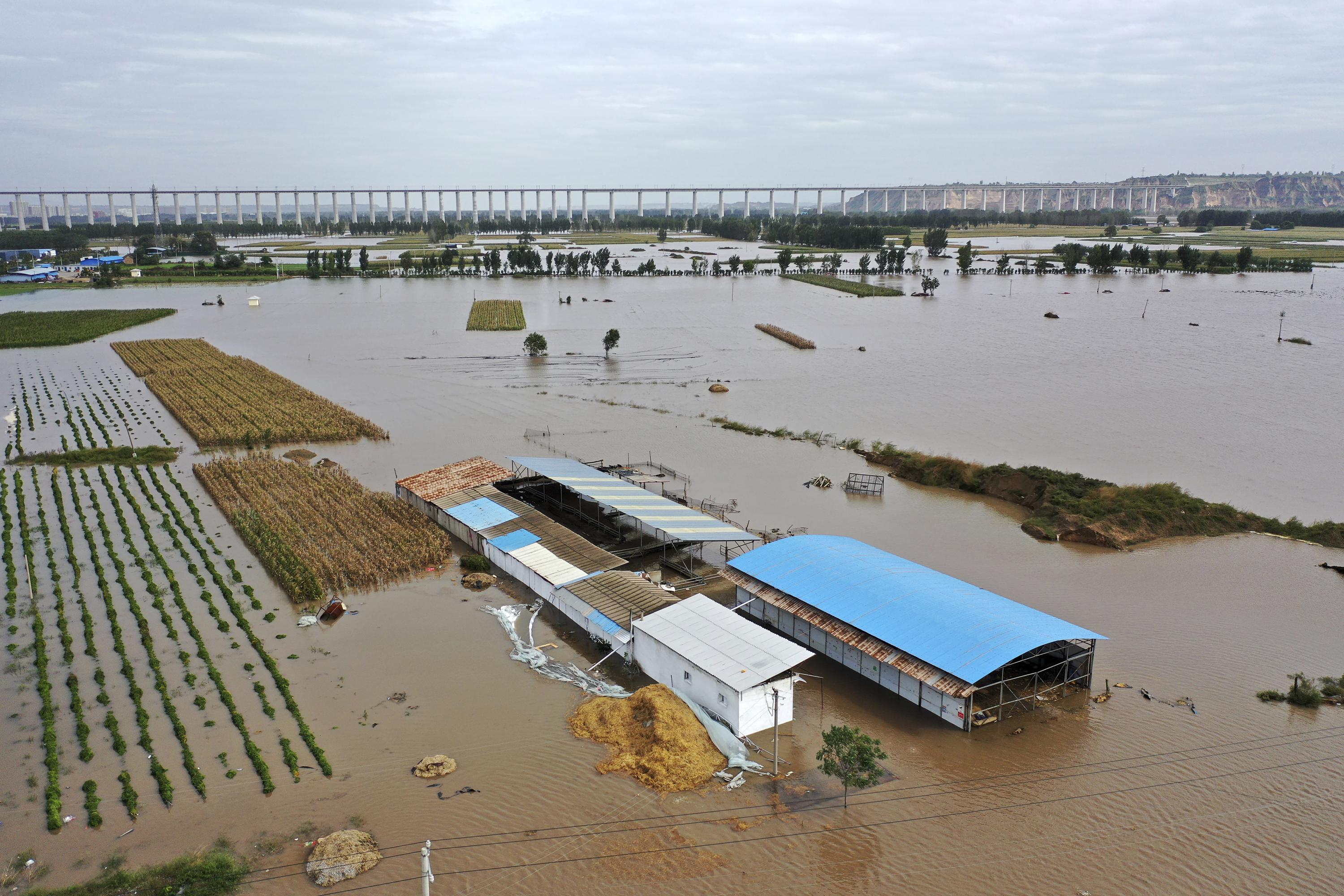 Bus plunge, floods leave at least 28 dead in northern China