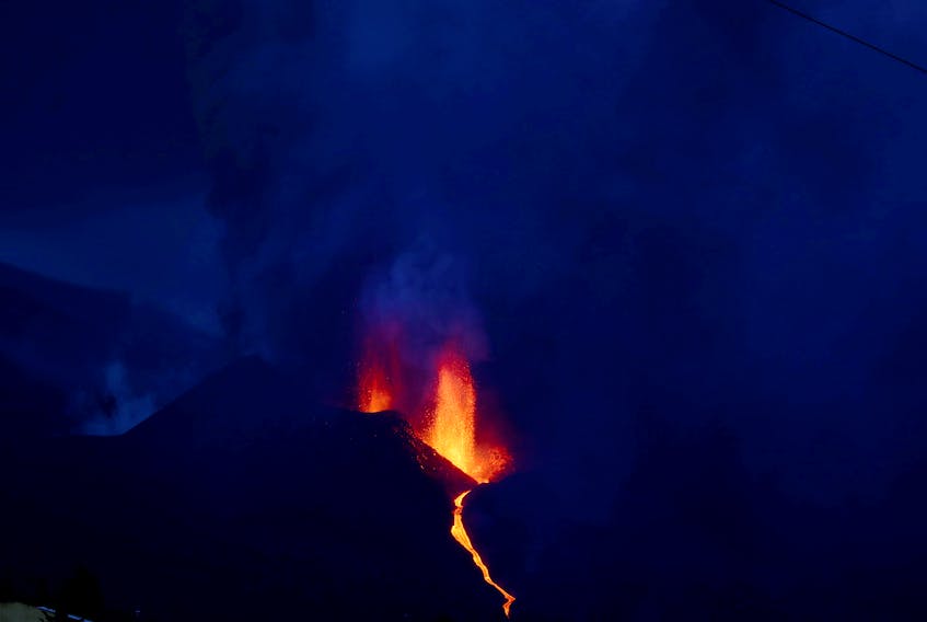 Hundreds evacuated as red-hot lava threatens homes in Spain's La Palma