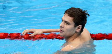 International swimming body suspends Russian Olympic champion for attending Putin rally