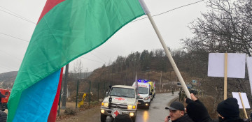  ICRC vehicles and two ambulances pass along Azerbaijan's Lachin road