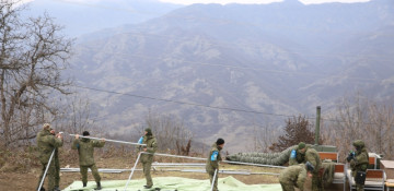 Russian peacekeepers dismantle tents they set up in area of protests on Lachin-Khankandi road