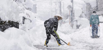 Japan's recent heavy snow has caused 13 deaths, many injuries