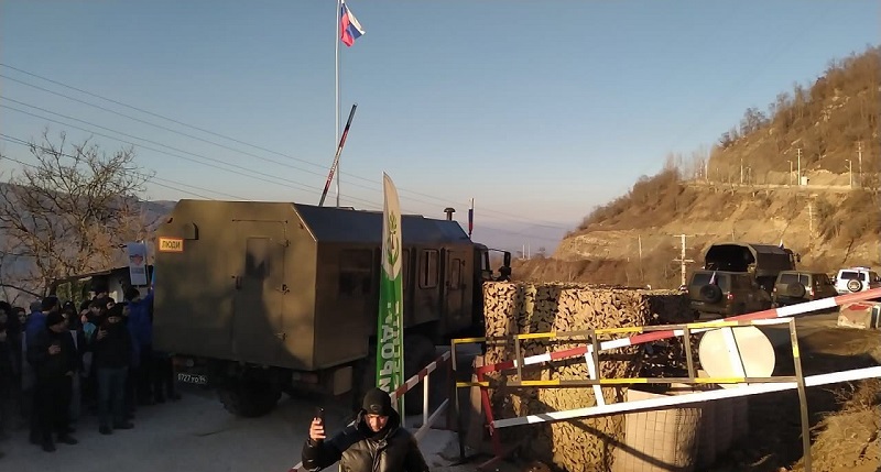 Several more vehicles of Russian peacekeepers pass freely along Lachin road