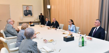 President Ilham Aliyev and First Lady Mehriban Aliyeva talk with ophthalmologists who worked at the same time with academician Zarifa Aliyeva