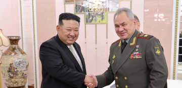 North Korea's Kim shows off banned missiles to Russian minister