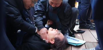 South Korean opposition leader stabbed in neck, expected to undergo surgery
