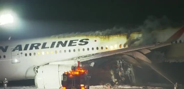 Planes collide in fiery crash on runway at Tokyo airport, 5 missing