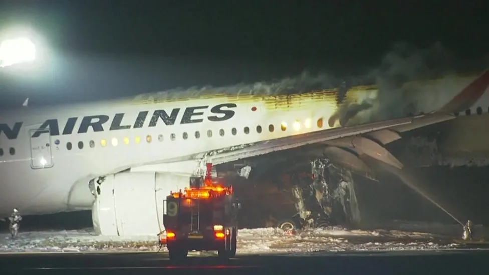 Planes collide in fiery crash on runway at Tokyo airport, 5 missing